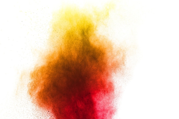 Red yellow powder explosion on white background.