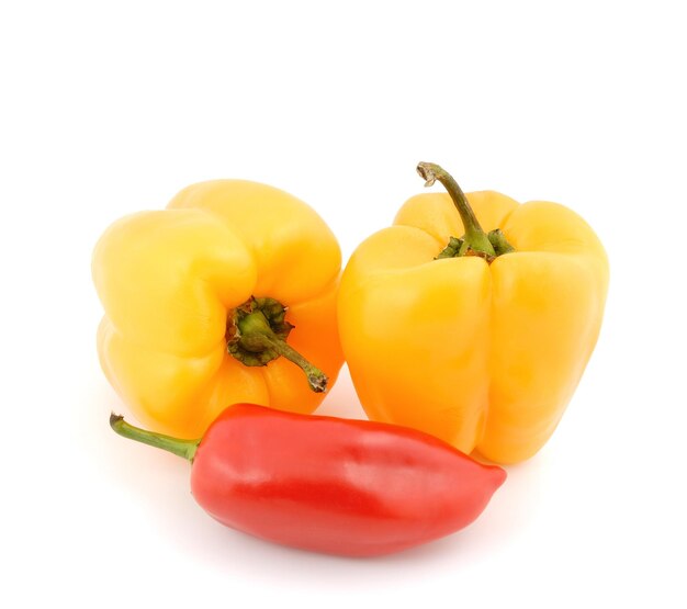 Red and yellow sweet peppers on a white background