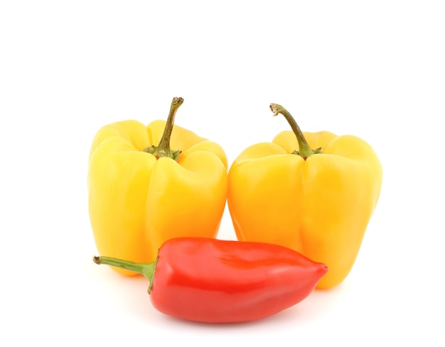 Red and yellow sweet peppers on a white background