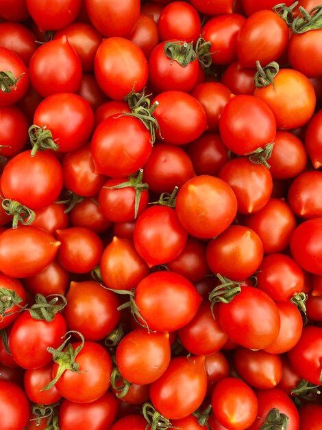 Red and yellow tomatoes in boxes at the farmers market.selective focus.nature