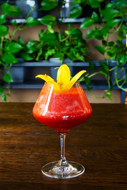 Redberry cocktail on a glass on the bar