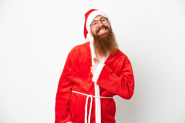 Reddish man disguised as Santa claus isolated on white giving a thumbs up gesture