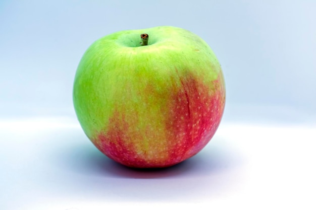 Redgreen apple on a white background