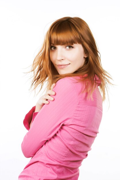 Redhair beauty over white background