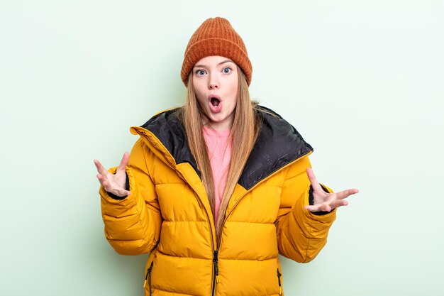 Redhair woman feeling extremely shocked and surprised. winter concept