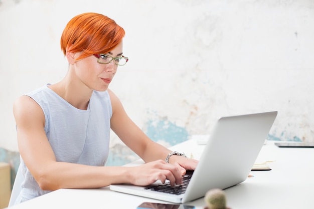 Redhair woman in office