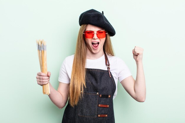 Redhair woman shouting aggressively with an angry expression. artist concept