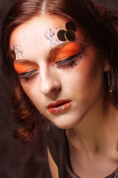 Redhair woman with bright creative make up