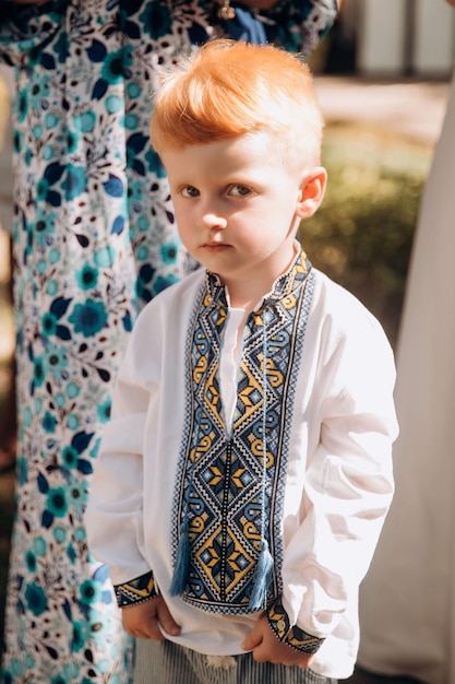 A redhaired boy in a Ukrainian white embroidered shirt Symbolic clothes of victory and democracy