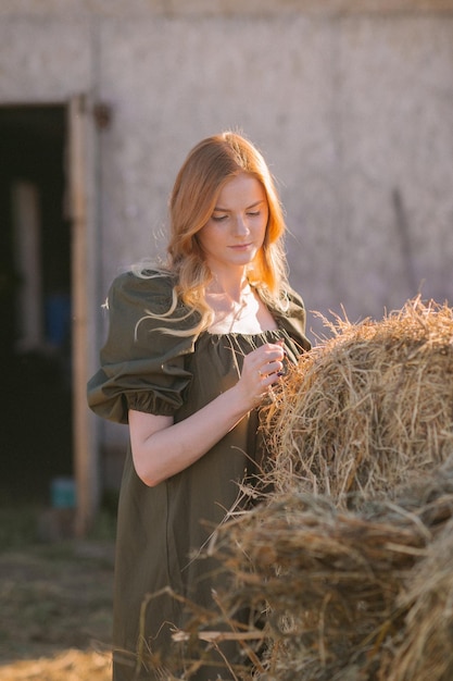 A redhaired girl and hay in the sunset 3263