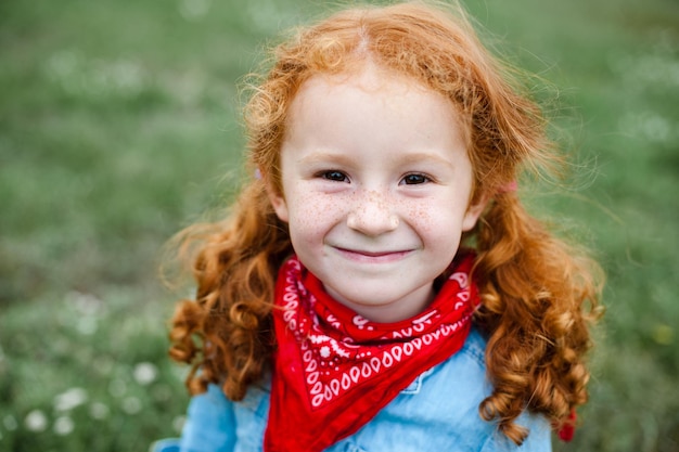 Redhaired mother and daughter have fun in nature