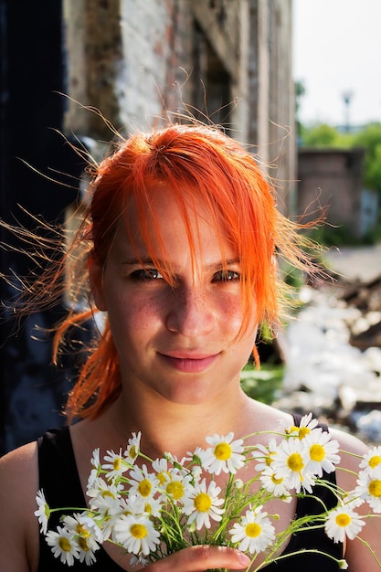 Redhead girl with daisies