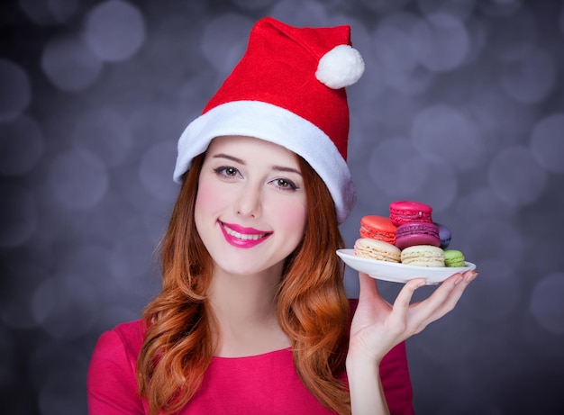 Redhead girl with macaron for Christmas