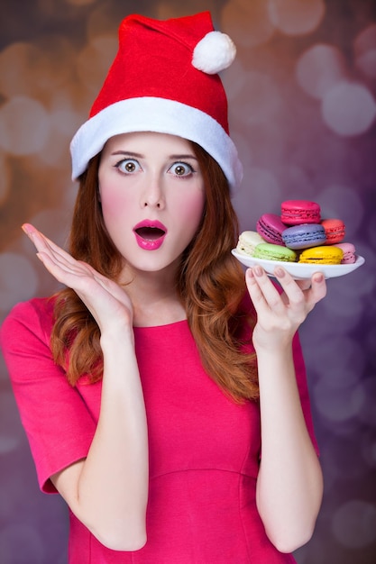 Redhead girl with macaron for Christmas