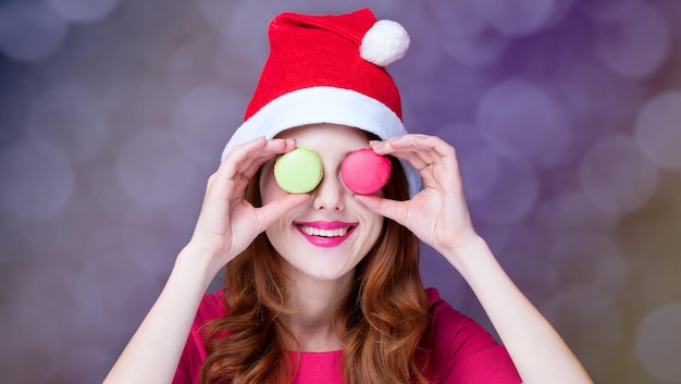 Redhead girl with macaron for Christmas