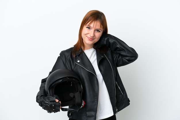 Redhead girl with a motorcycle helmet isolated on white background laughing