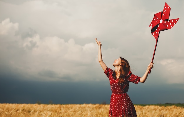 Redhead girl with toy wind turbine