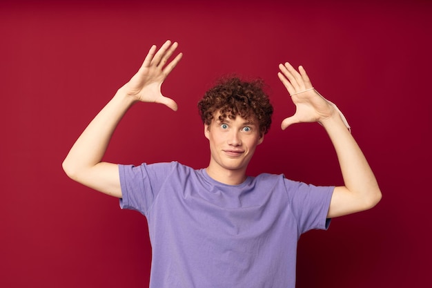 Redhead guy with curly hair posing gesture with hands