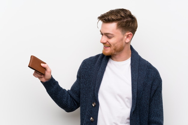 Redhead man holding a wallet