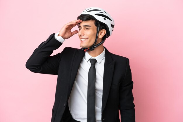 Redhead man on isolated blue wall showing an ok sign with fingers