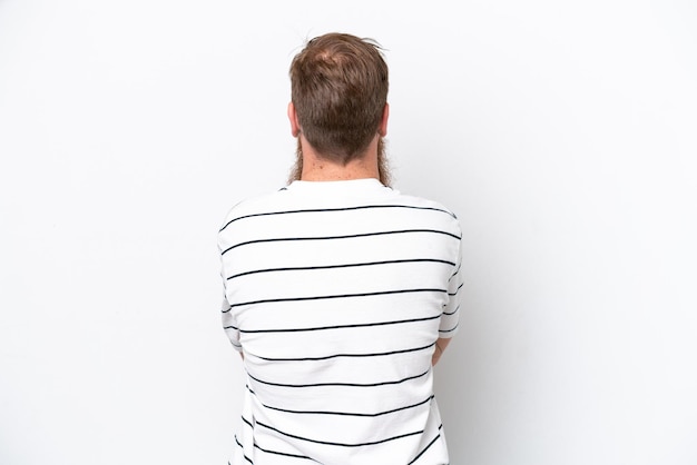 Redhead man with beard isolated on white background in back position