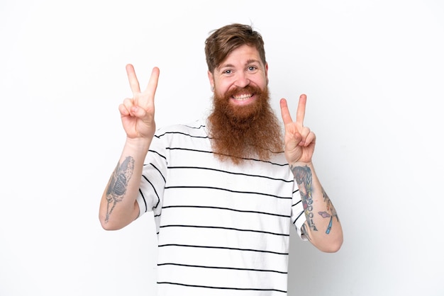 Redhead man with beard isolated on white background showing victory sign with both hands