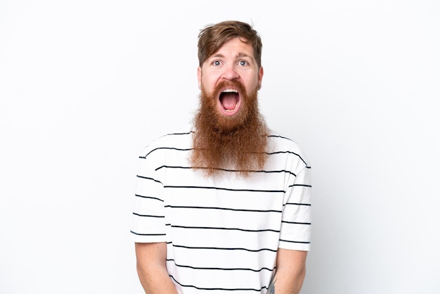 Redhead man with beard isolated on white background with surprise facial expression