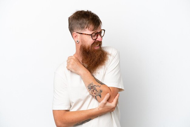 Redhead man with long beard isolated on white background with\
pain in elbow