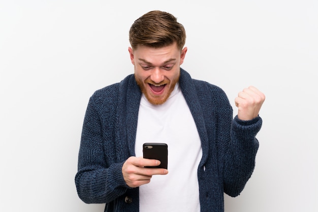 Redhead man with mobile