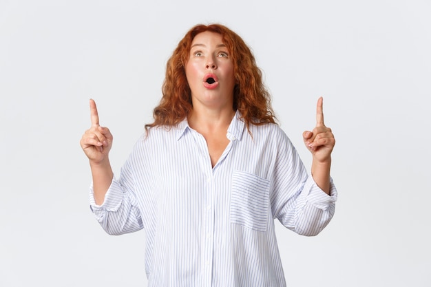 Redhead middle-aged woman posing