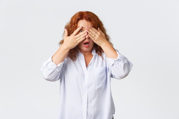 Redhead middle-aged woman posing