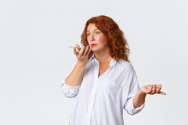 Redhead middle-aged woman posing