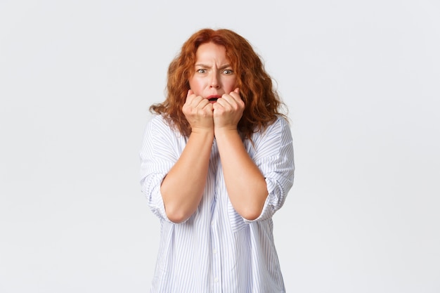 Redhead middle-aged woman posing