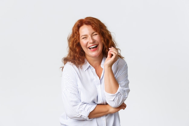 Redhead middle-aged woman posing