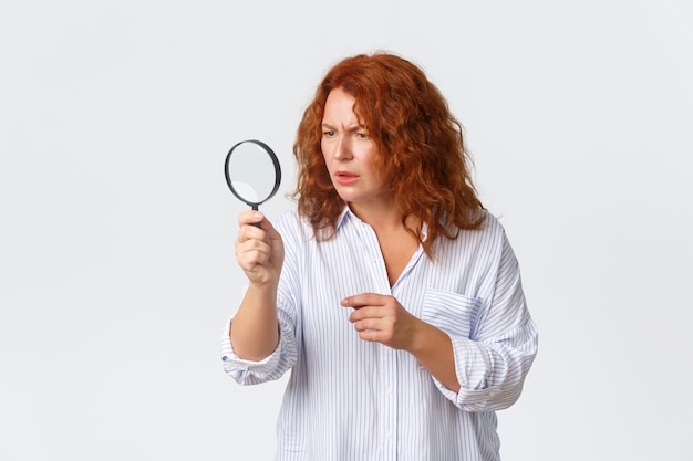 Redhead middle-aged woman posing