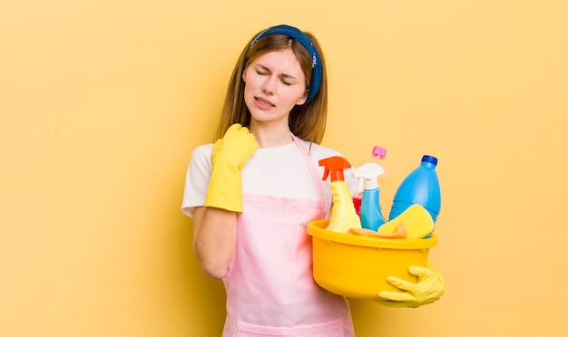 Redhead pretty girl feeling stressed anxious tired and frustrated housekeeper concept