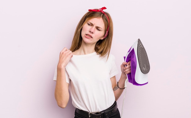 Redhead pretty girl feeling stressed anxious tired and frustrated housekeeper concept