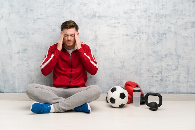 Redhead sport man with headache