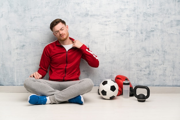 Redhead sport man with tired and sick expression