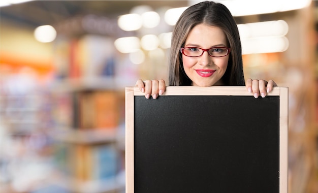 Redhead student with blackboard.