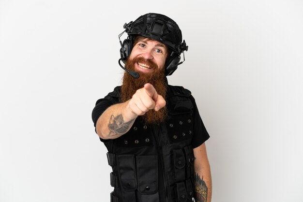 Redhead SWAT isolated on white background points finger at you with a confident expression