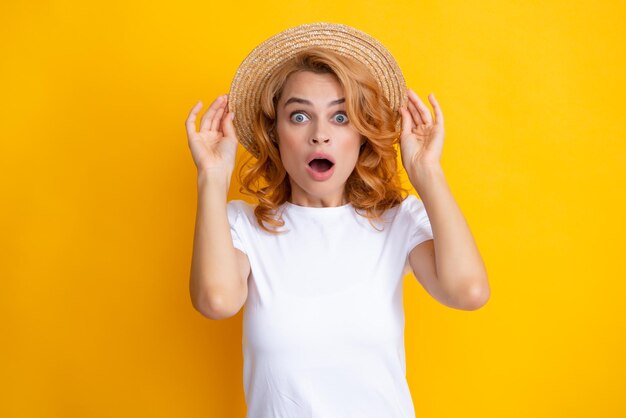 Redhead young beautiful excited amazed woman in straw hat\
summer mood expressive girl with surprised face portrait of young\
smiling cheerful caucasian pretty gild ginger hair