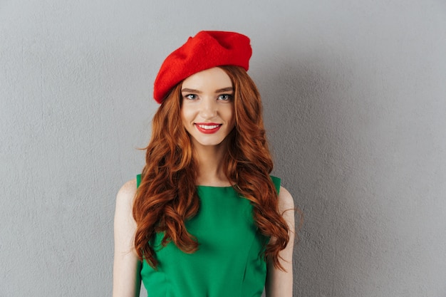 Redhead young happy lady in green dress