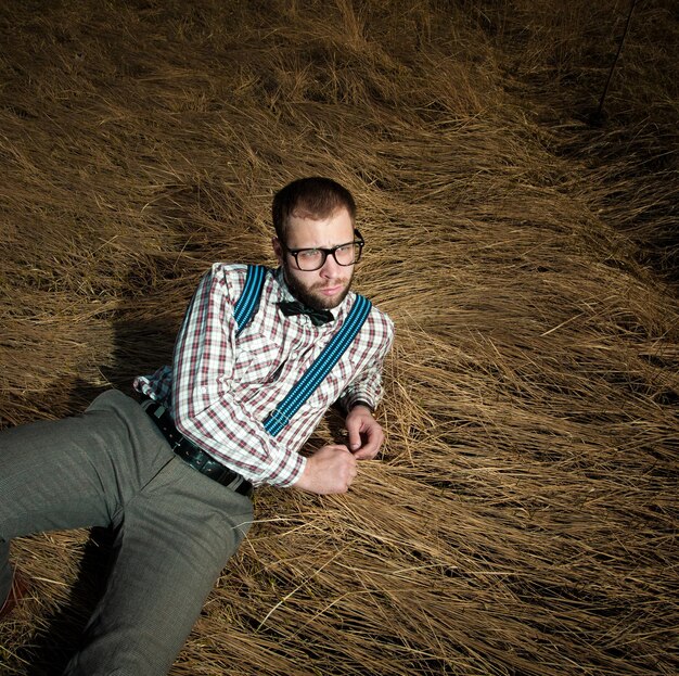 Redneck nerd man in glasses with beard outdoor