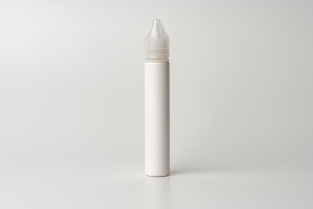 Refill liquid for electronic cigarettes on gray background