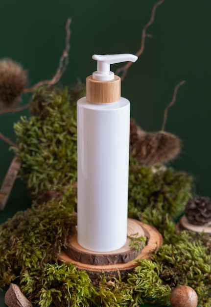 Refillable Cosmetic Pump Dispenser on wooden piece near green moss closeup Label mockup