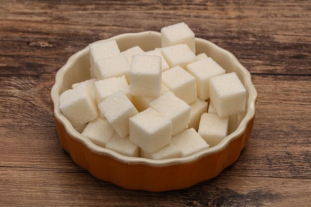 Refined white sugar cubs in the bowl