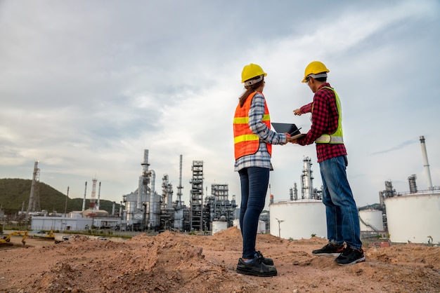 Refinery industry engineer wearing ppe at refinery construction\
site