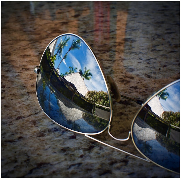 Photo reflection of building on sunglasses