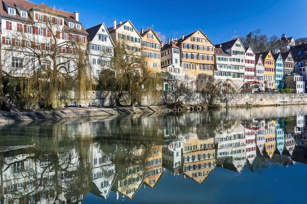 Reflection of buildings in lake against sky